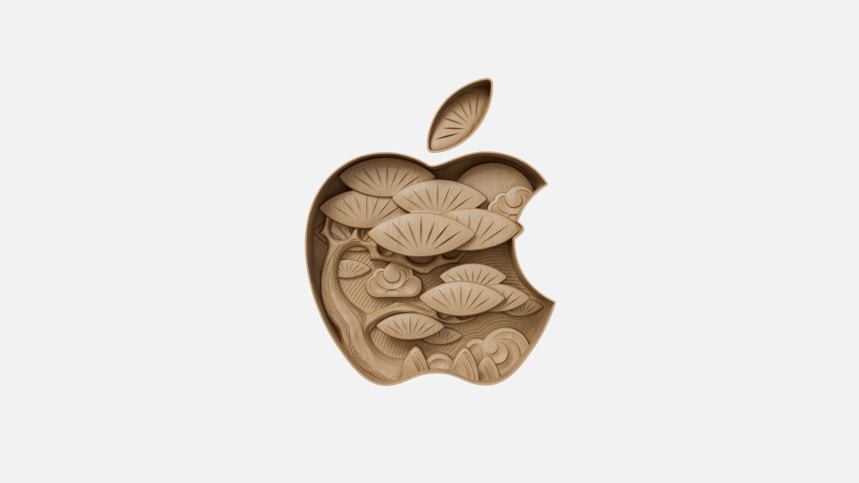 The Apple logo, but as if it&rsquo;s centre is carved out of wood. The carving is of a tree.